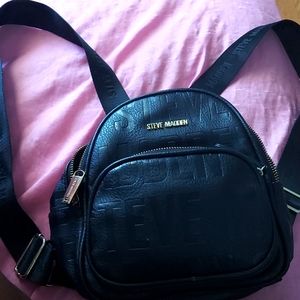 A mini backpack for like little room like a girls purse